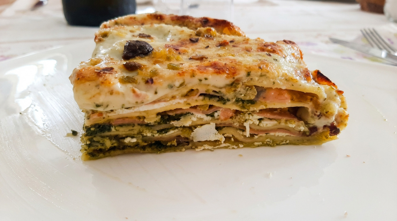 A tray of freshly baked lasagne, cooked in a family kitchen